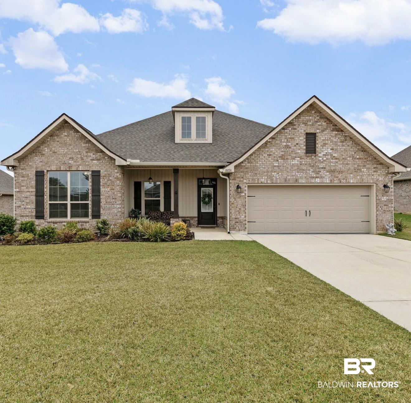 10126 Chipper Lane Foley, AL 36535 - Photo 1 of 30 Craftsman-style house featuring roof with shingles, a front lawn, a porch, driveway, and an attached garage