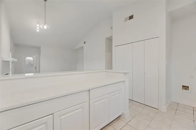 a room with cabinets and a closet