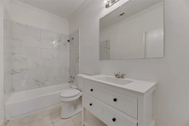 a bathroom with a sink a toilet and bathtub