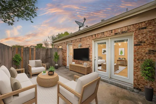 a outdoor space with patio the couches and a fireplace