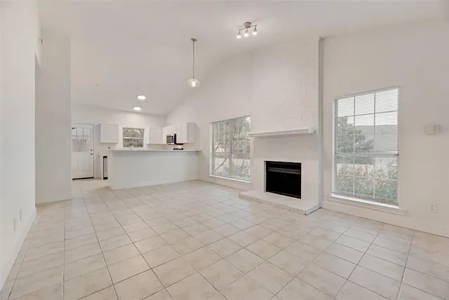 a view of a kitchen with furniture and a fireplace