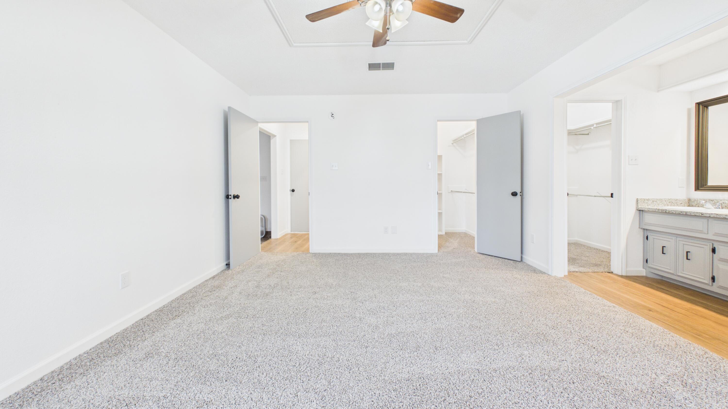 6902 Homestead Avenue Lubbock, TX 79424 - Photo 13 of 17 a view of an empty room with a ceiling fan