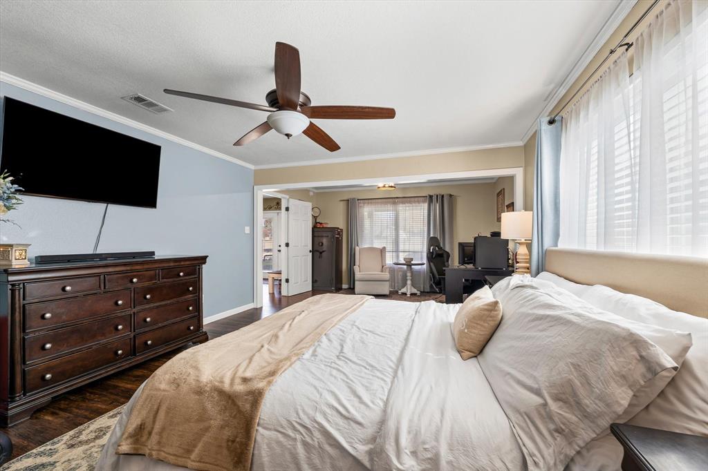 134 Thiele Road Lorena, TX 76655 - Photo 11 of 37 a bedroom with a bed a flat screen tv and a window