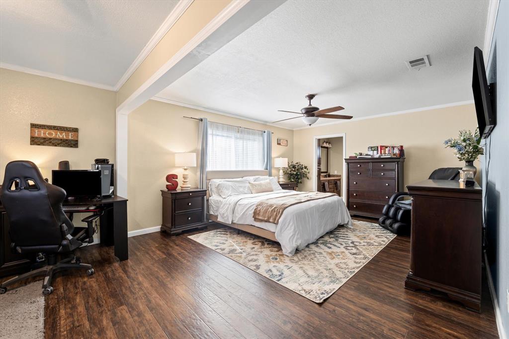 134 Thiele Road Lorena, TX 76655 - Photo 13 of 37 a bedroom with a bed and wooden floor