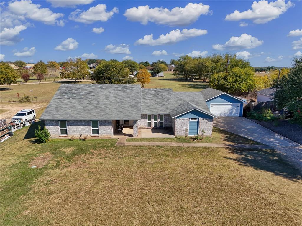 134 Thiele Road Lorena, TX 76655 - Photo 6 of 37 a view of house with a yard and ocean view