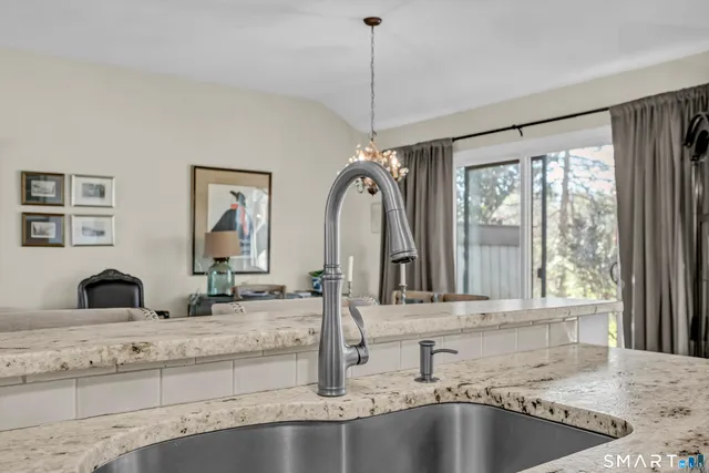 a bathroom with sinks mirror and a bathtub