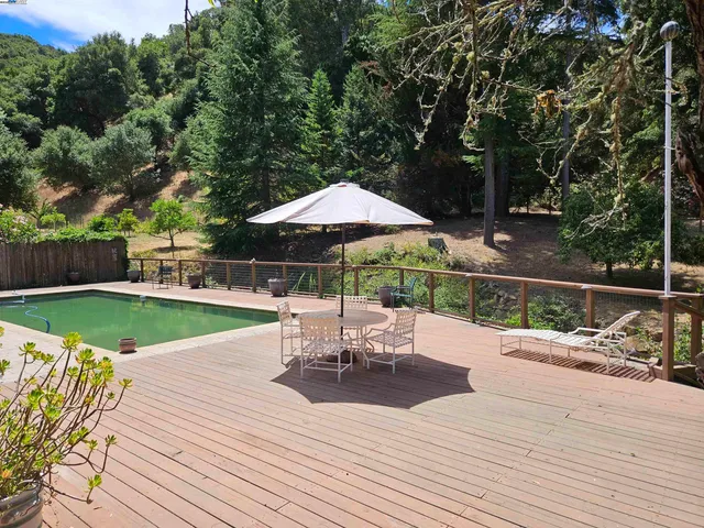 a view of a patio with chair and table of the house