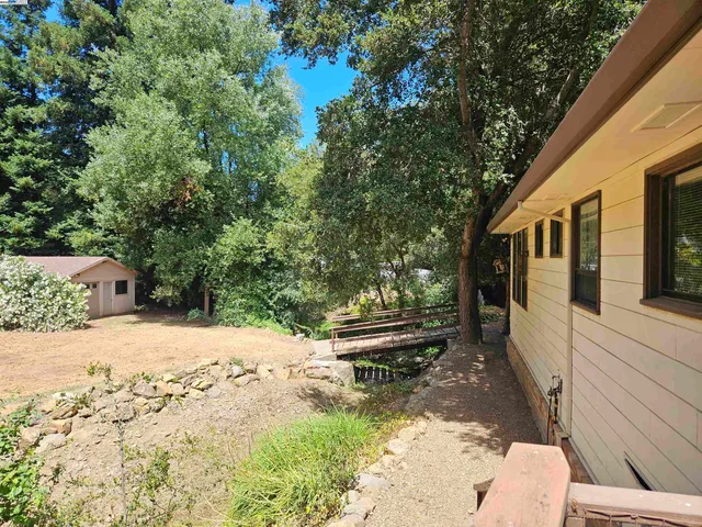 a view of a patio with a yard