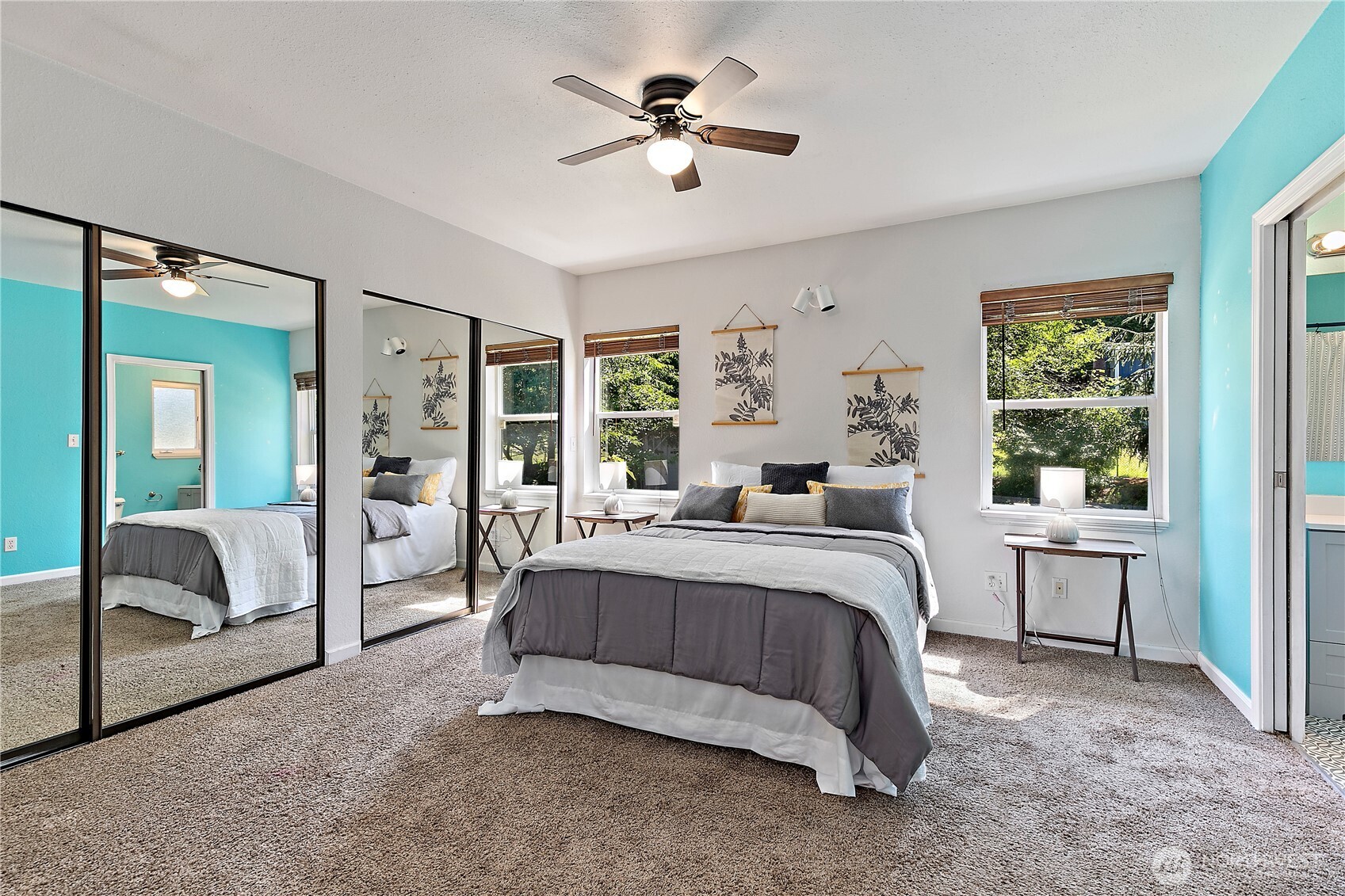9880 Fredrickson Road Northwest Bremerton, WA 98311 - Photo 14 of 28 a spacious bedroom with a bed and a chandelier