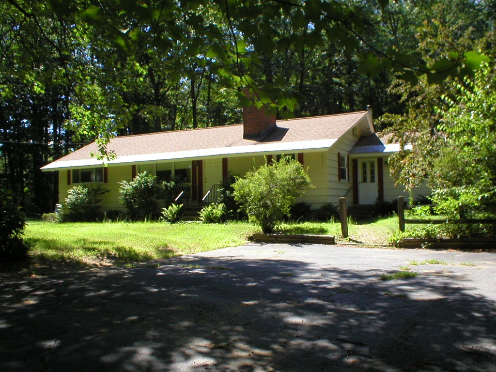 603 Turnpike Road Ashby, MA 01431 - Photo 1 of 17 a view of a house with a yard and large trees