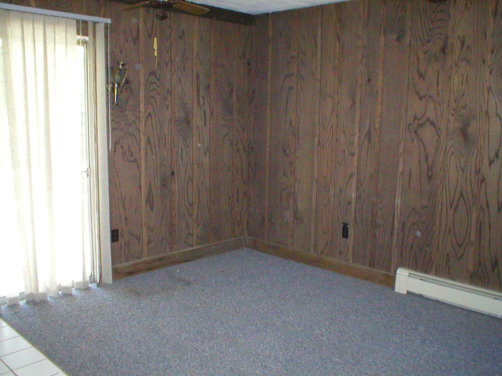 603 Turnpike Road Ashby, MA 01431 - Photo 12 of 17 a view of an empty room with a wooden door
