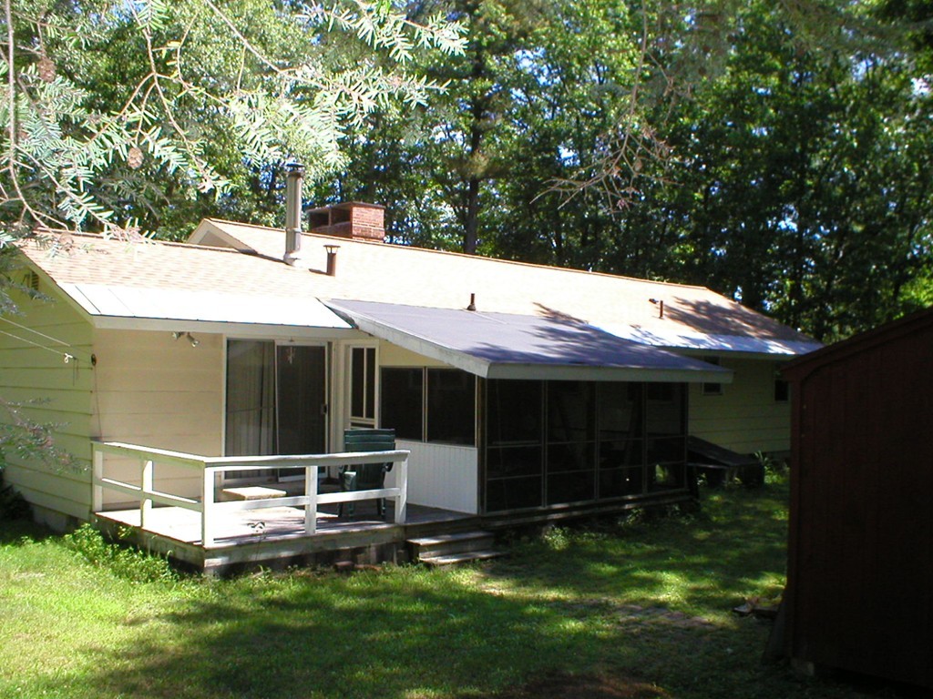 603 Turnpike Road Ashby, MA 01431 - Photo 15 of 17 a view of a house with backyard and sitting area