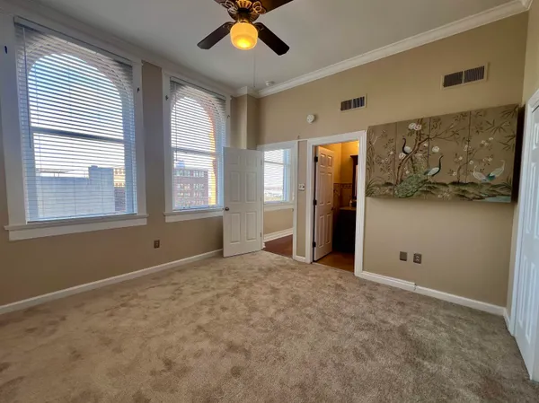 a view of an empty room with a window