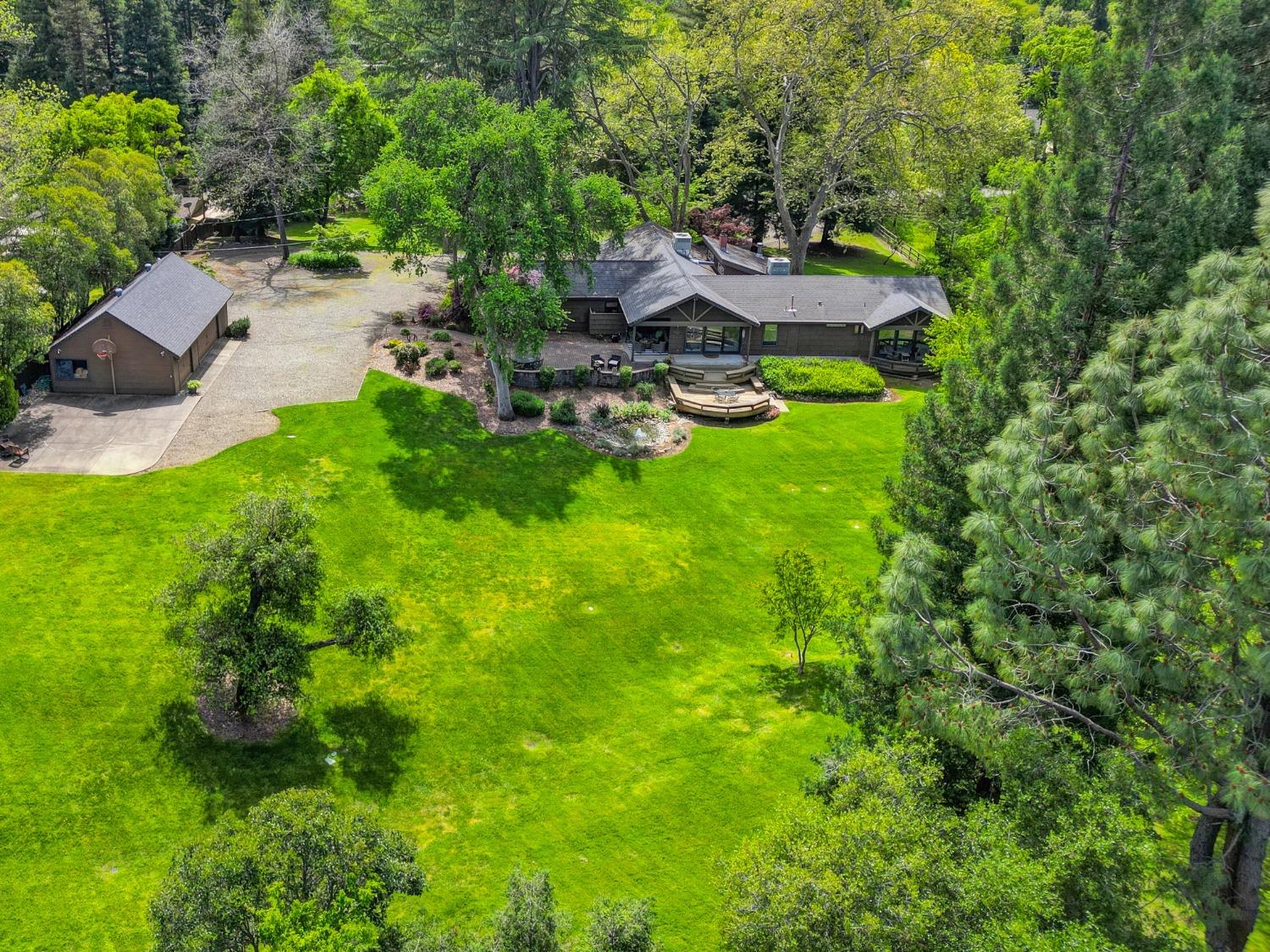a view of a backyard with sitting area