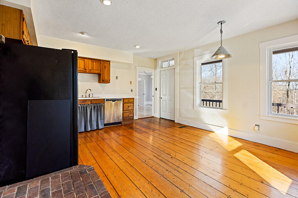 247 Winthrop Center Road Winthrop, ME 04364 - Photo 4 of 42 Kitchen to front deck door