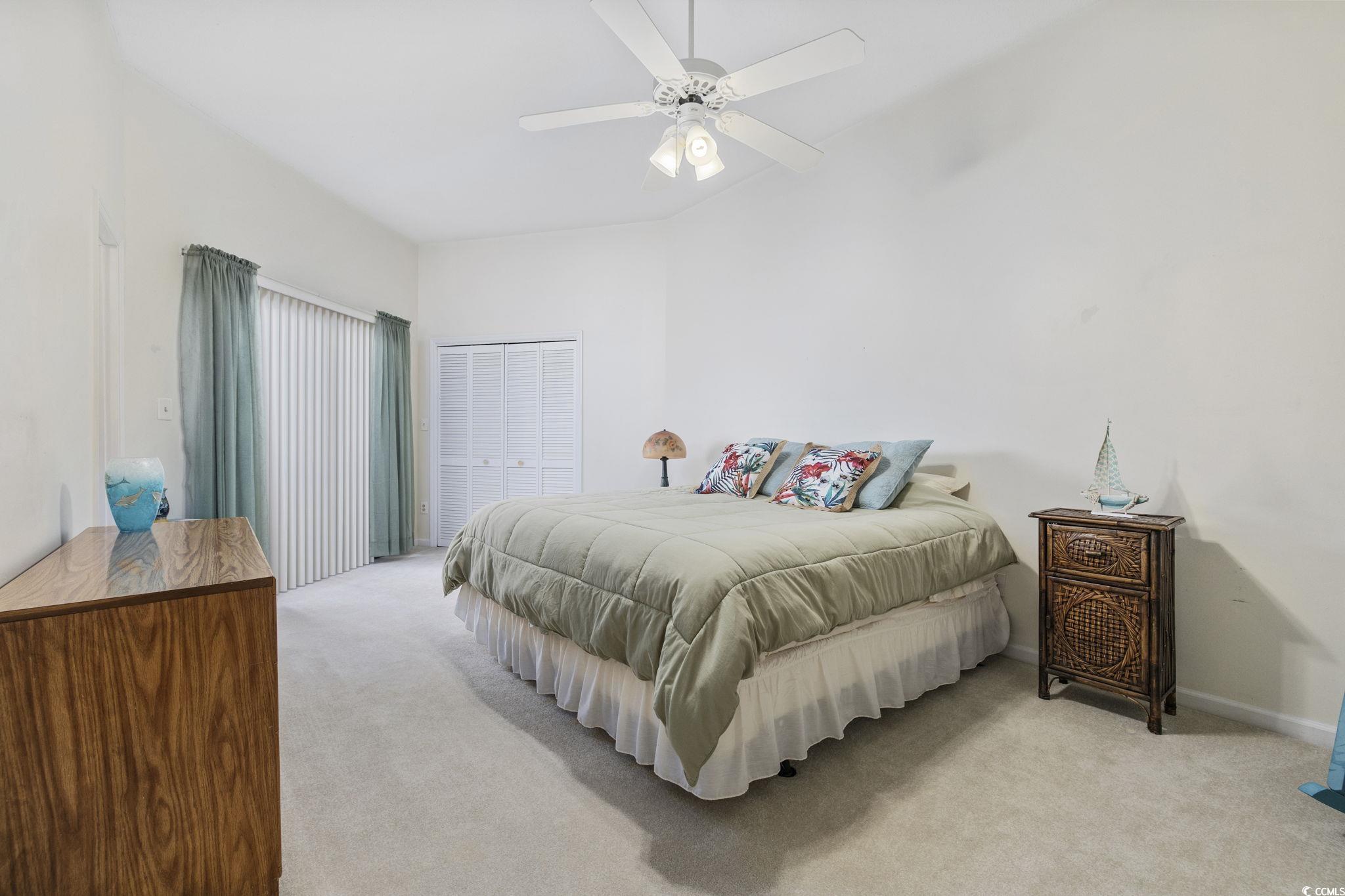 611 13th Avenue North, Unit 175 Surfside Beach, SC 29575 - Photo 16 of 31 Carpeted bedroom featuring ceiling fan