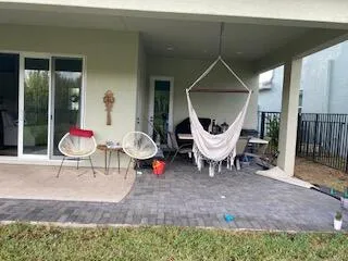 a living room with furniture and a mirror