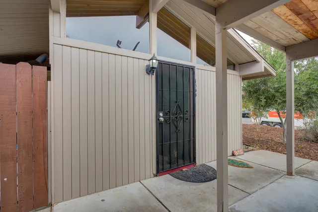 a kitchen with stainless steel appliances granite countertop a large stove a sink dishwasher and a refrigerator with wooden floor