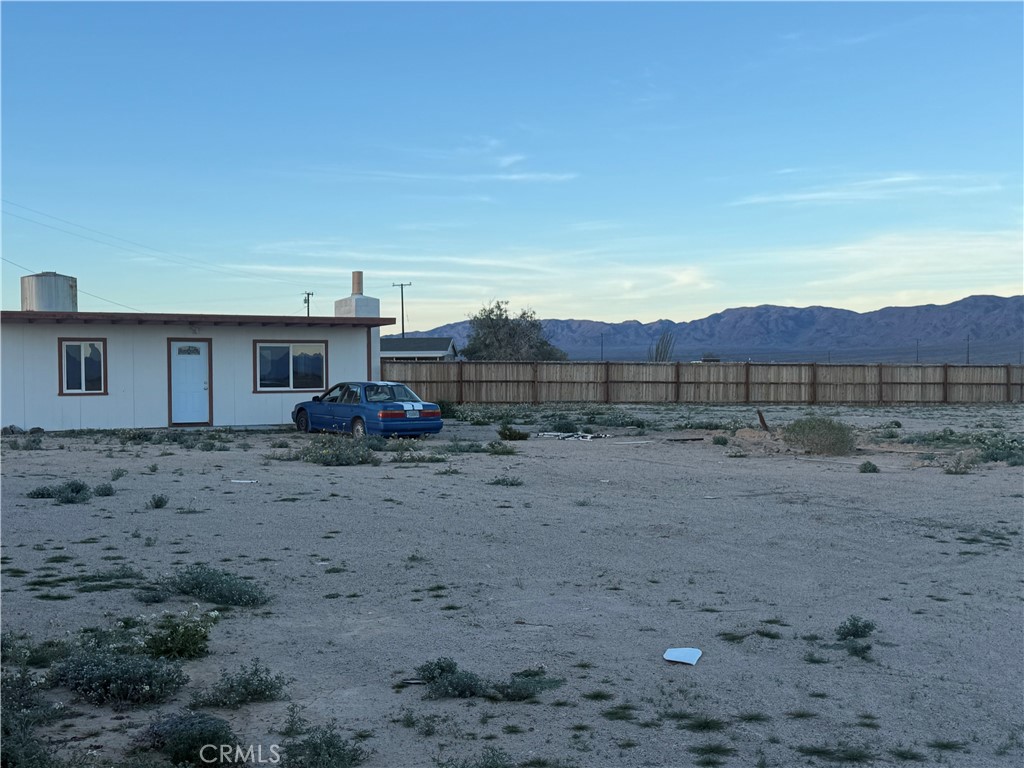 81818 Carey Road Twentynine Palms, CA 92277 - Photo 4 of 7 a view of a house with a yard