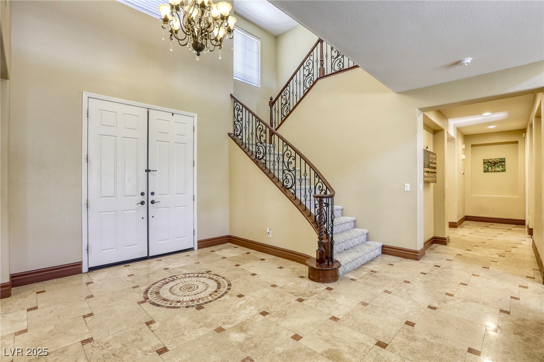 7516 Via Fiorentino Street Las Vegas, NV 89131 - Photo 51 of 94 The chandelier adds class to your grand foyer!