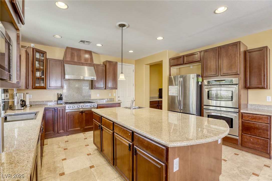 7516 Via Fiorentino Street Las Vegas, NV 89131 - Photo 63 of 94 Built-in ovens (TWO!) and extra lighting.