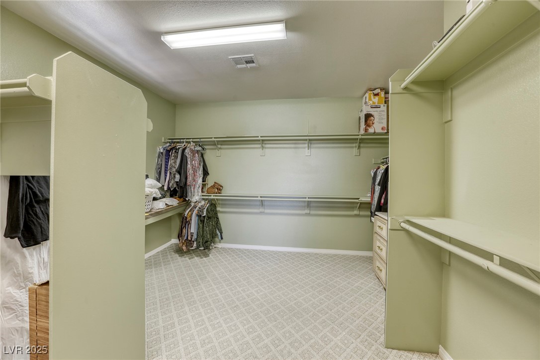 7516 Via Fiorentino Street Las Vegas, NV 89131 - Photo 90 of 94 The primary bedroom closet is truly room-sized!