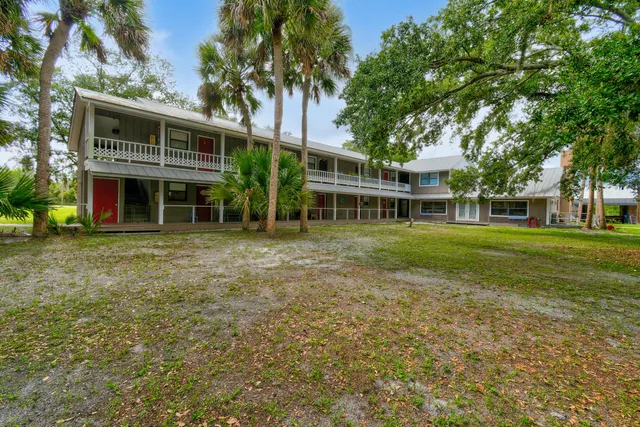 a kitchen with a sink a stove and cabinets