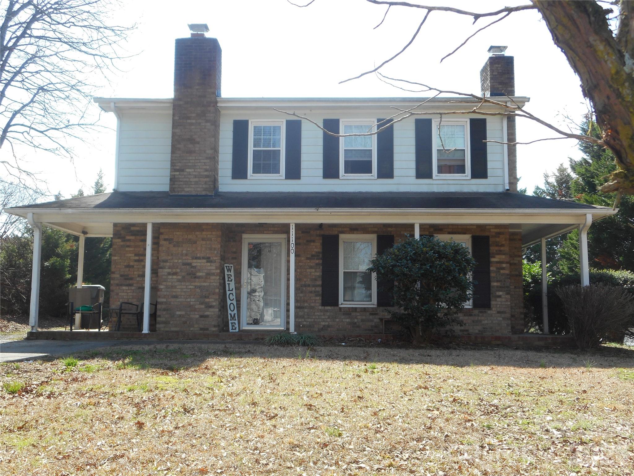 8001 Carmel Road Charlotte, NC 28226 - Photo 19 of 22 front view of a house with a yard