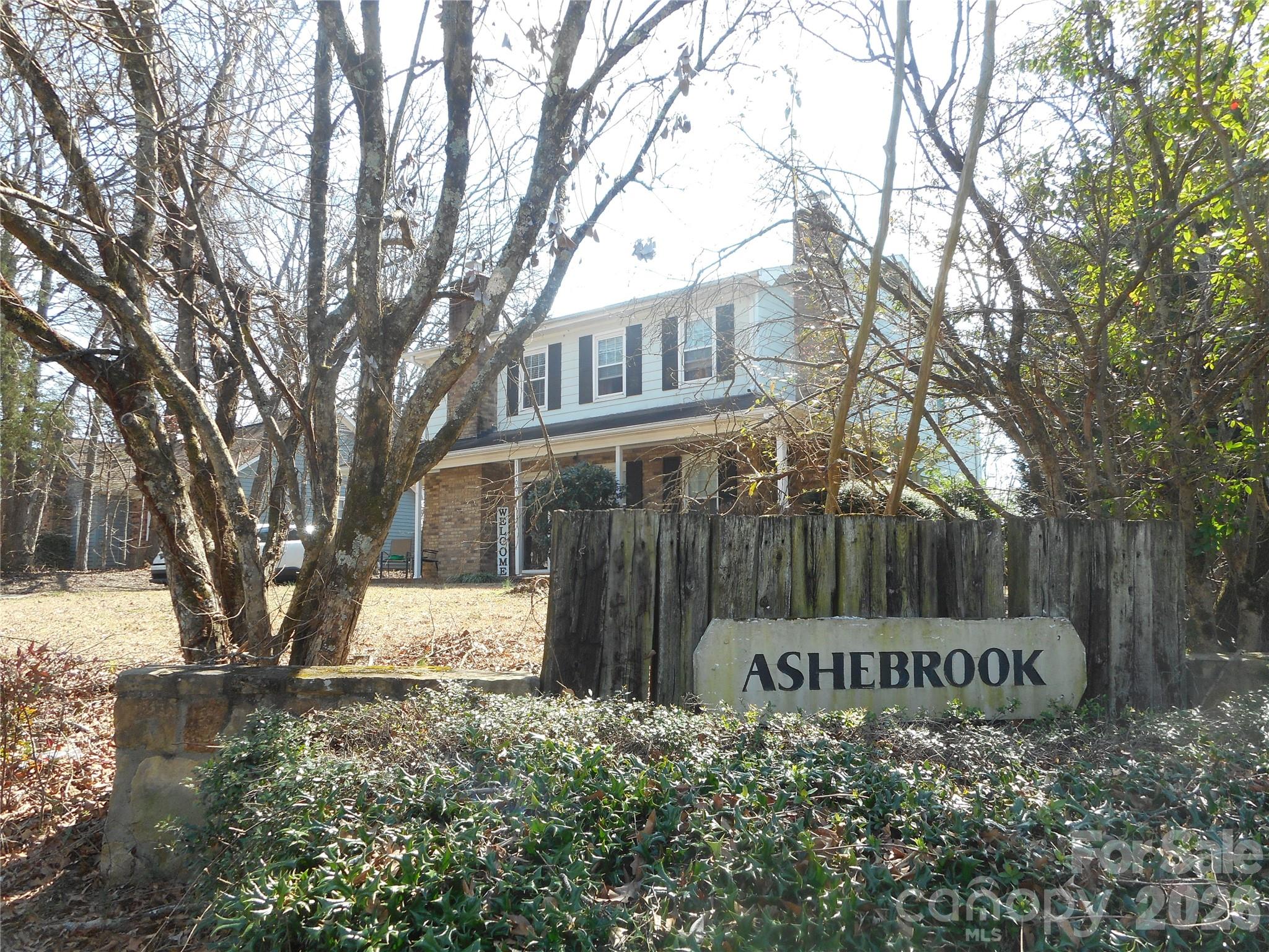 8001 Carmel Road Charlotte, NC 28226 - Photo 20 of 22 a front view of a house with a yard