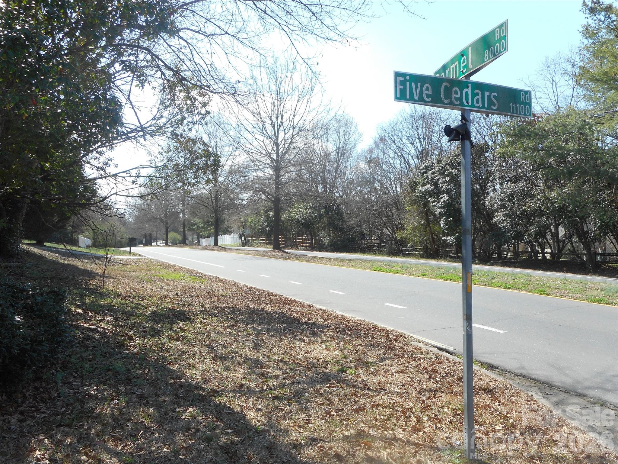8001 Carmel Road Charlotte, NC 28226 - Photo 22 of 22 a view of a house with a yard and tree s