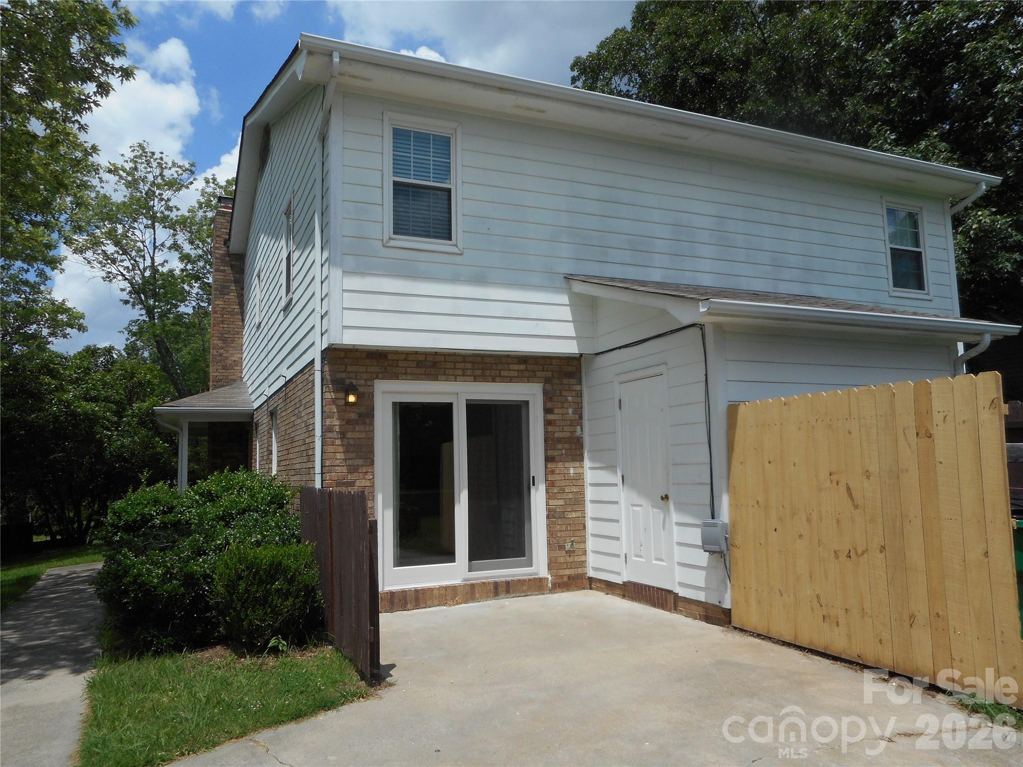 8001 Carmel Road Charlotte, NC 28226 - Photo 4 of 22 a view of a house with a garage