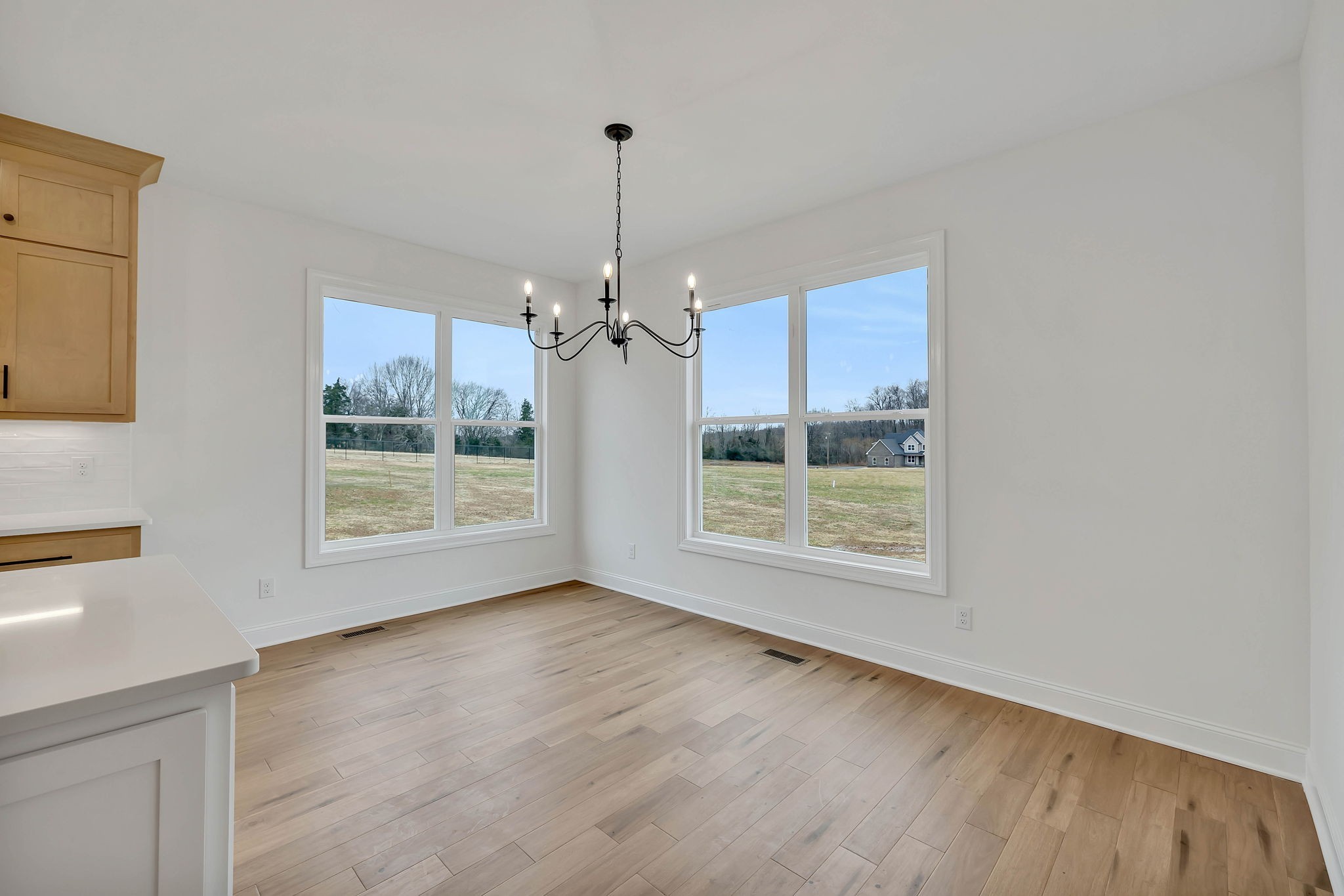 7341 North Milton Road Milton, TN 37118 - Photo 15 of 36 a view of an empty room with a window and wooden floor