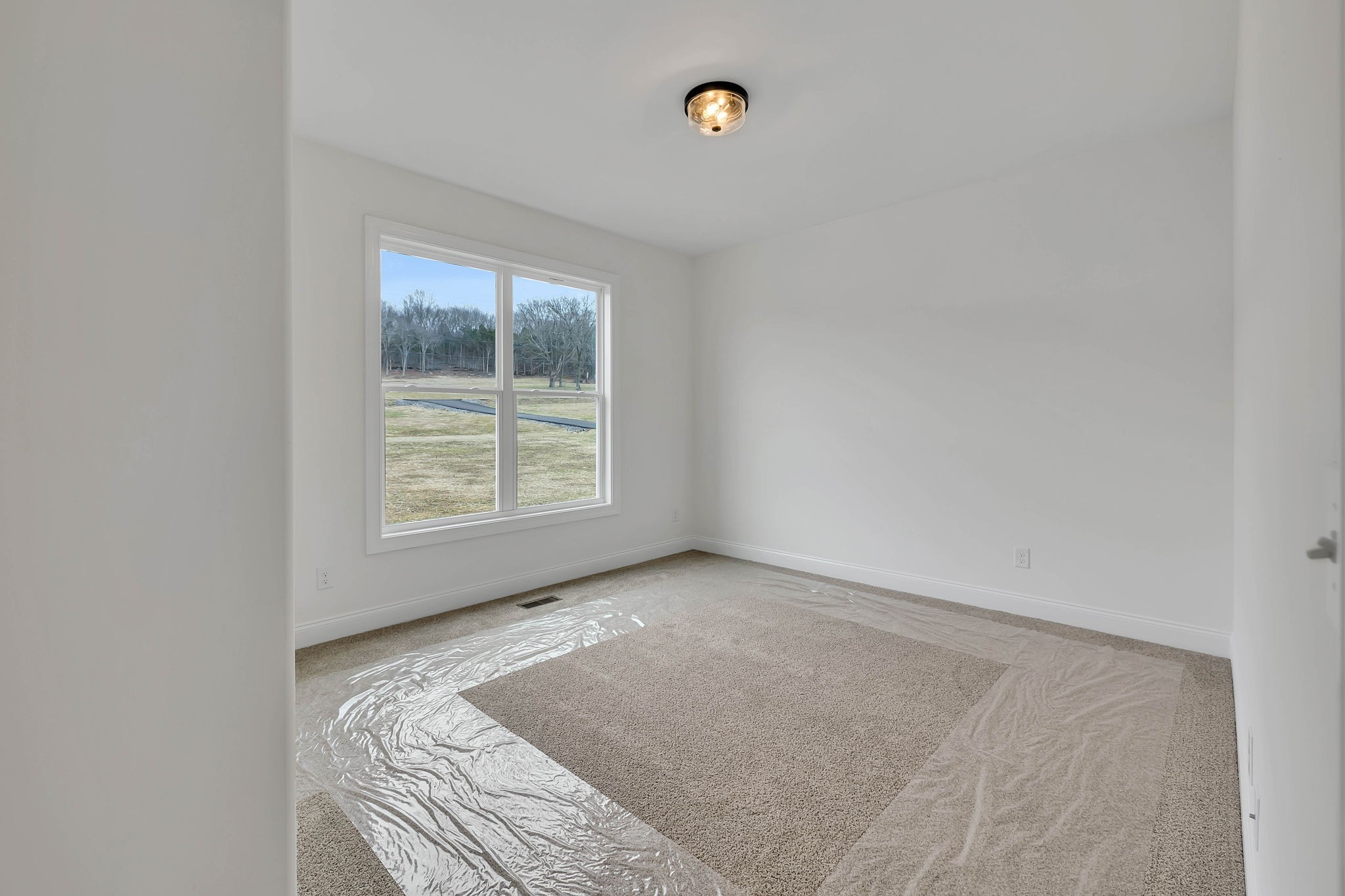7341 North Milton Road Milton, TN 37118 - Photo 25 of 36 a view of a bedroom with a bed and a window