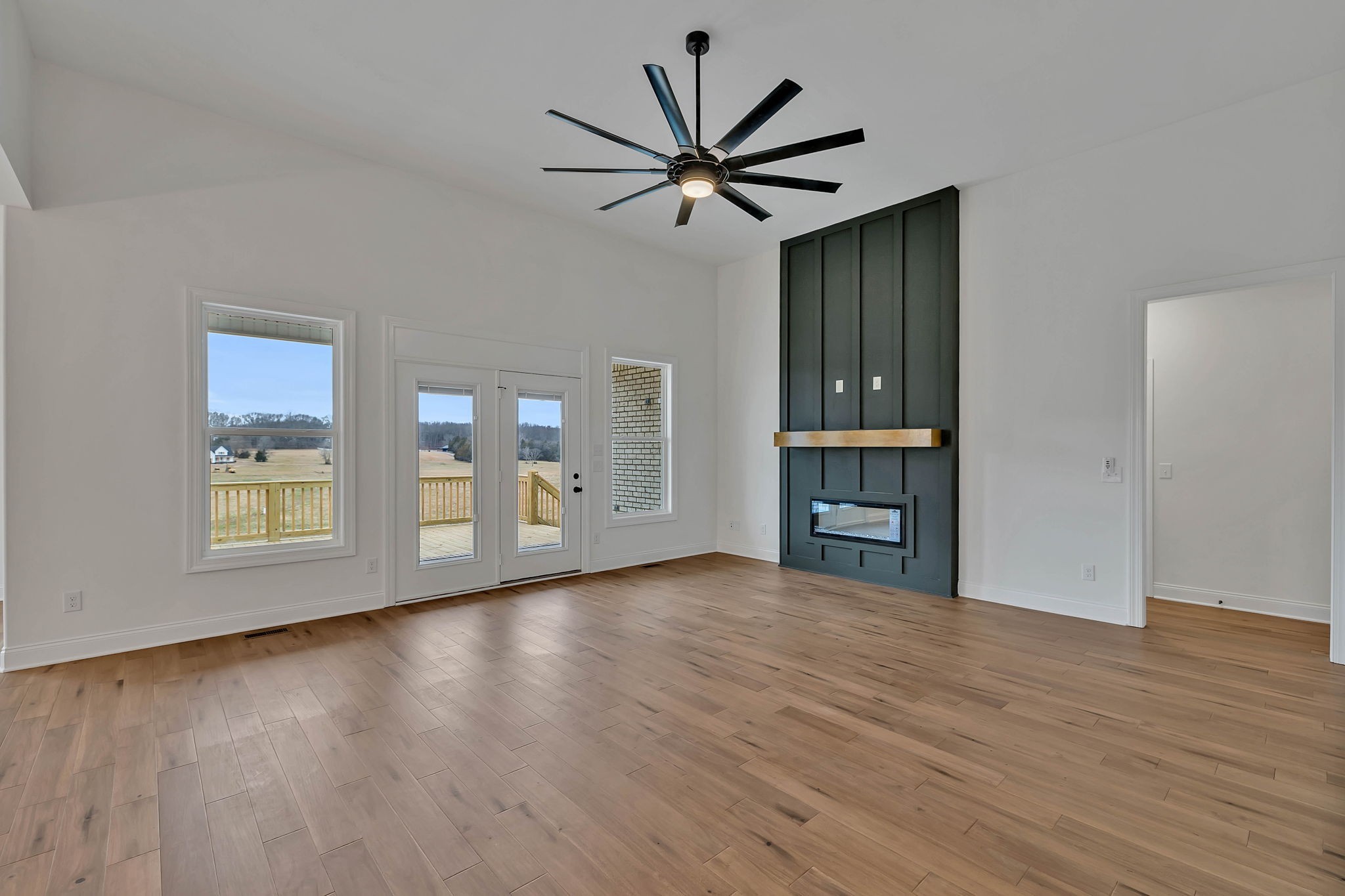 7341 North Milton Road Milton, TN 37118 - Photo 7 of 36 a view of empty room with wooden floor and fan