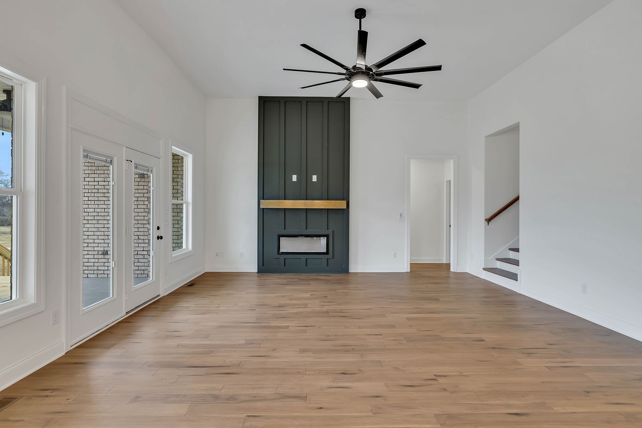 7341 North Milton Road Milton, TN 37118 - Photo 8 of 36 a view of an empty room with wooden floor and a window