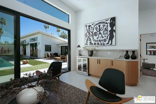 a living room with furniture and a swimming pool
