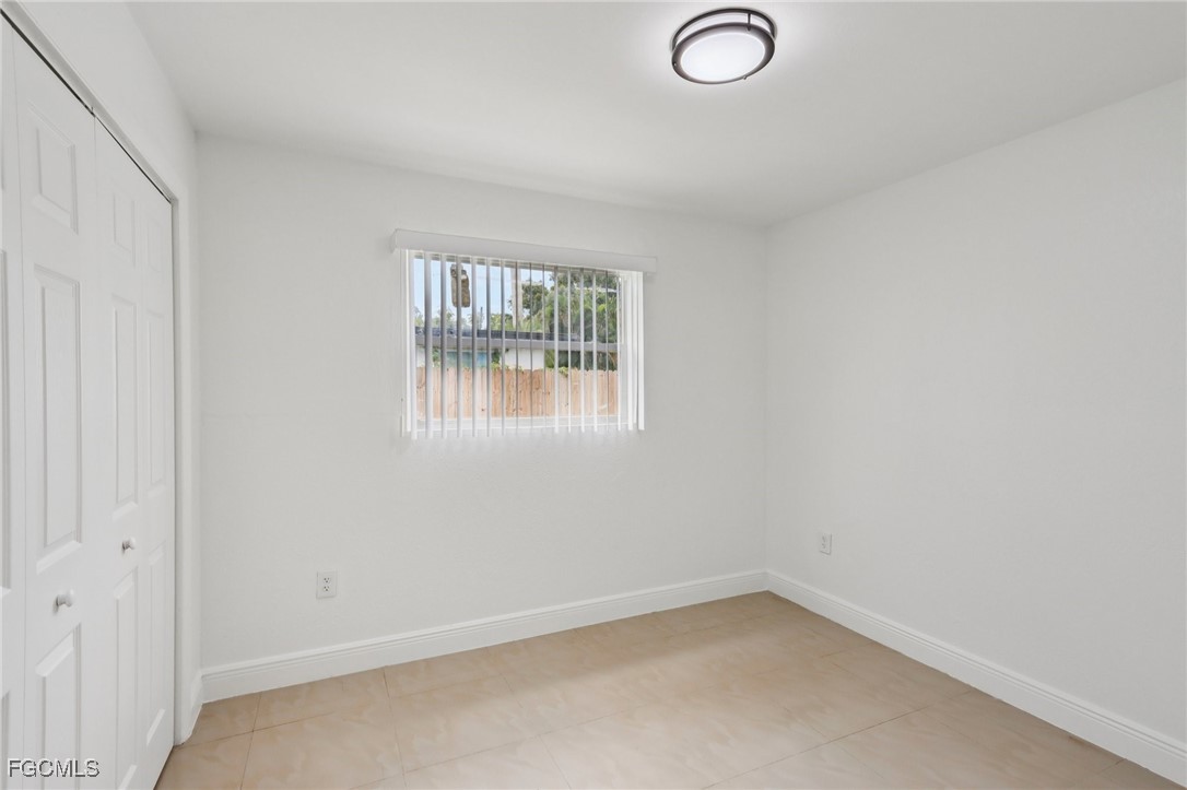 89 Cabana Avenue North Fort Myers, FL 33903 - Photo 11 of 29 an empty room with windows