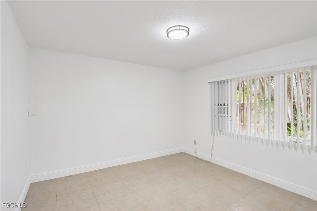 89 Cabana Avenue North Fort Myers, FL 33903 - Photo 16 of 29 an empty room with a window