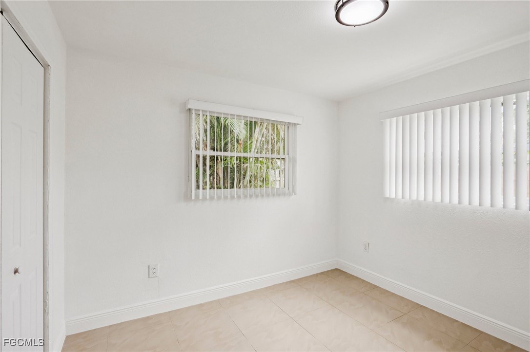 89 Cabana Avenue North Fort Myers, FL 33903 - Photo 18 of 29 an empty room with windows