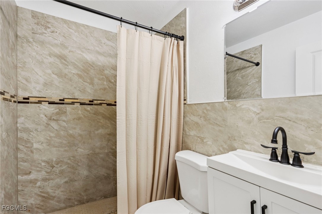 89 Cabana Avenue North Fort Myers, FL 33903 - Photo 10 of 29 a bathroom with a sink and a mirror