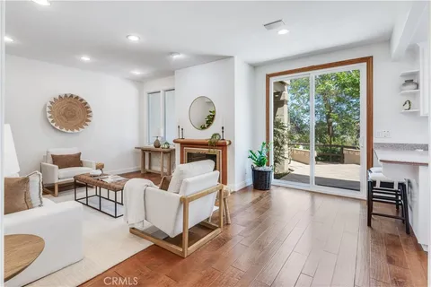 a living room with furniture and a lamp