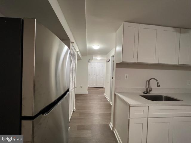 908 Chatsworth Drive Accokeek, MD 20607 - Photo 23 of 24 a kitchen with a sink and refrigerator