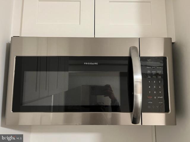 908 Chatsworth Drive Accokeek, MD 20607 - Photo 8 of 24 a kitchen with a cabinets and a fireplace