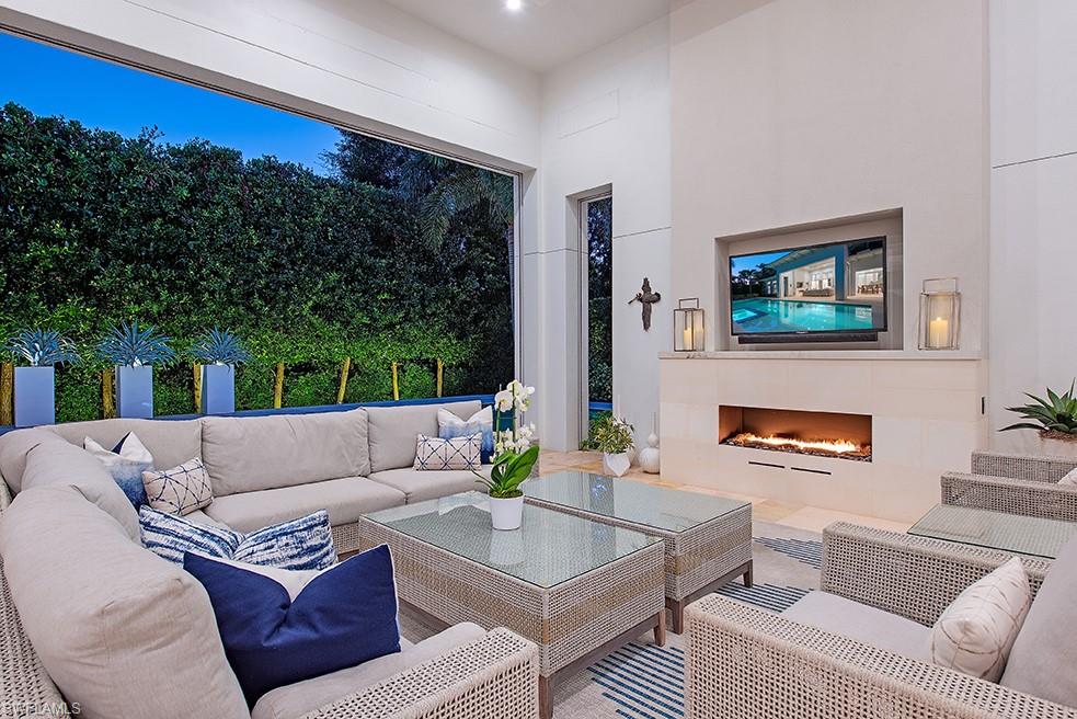 452 Putter Point Drive Naples, FL 34103 - Photo 26 of 28 Roll down screens and shutters