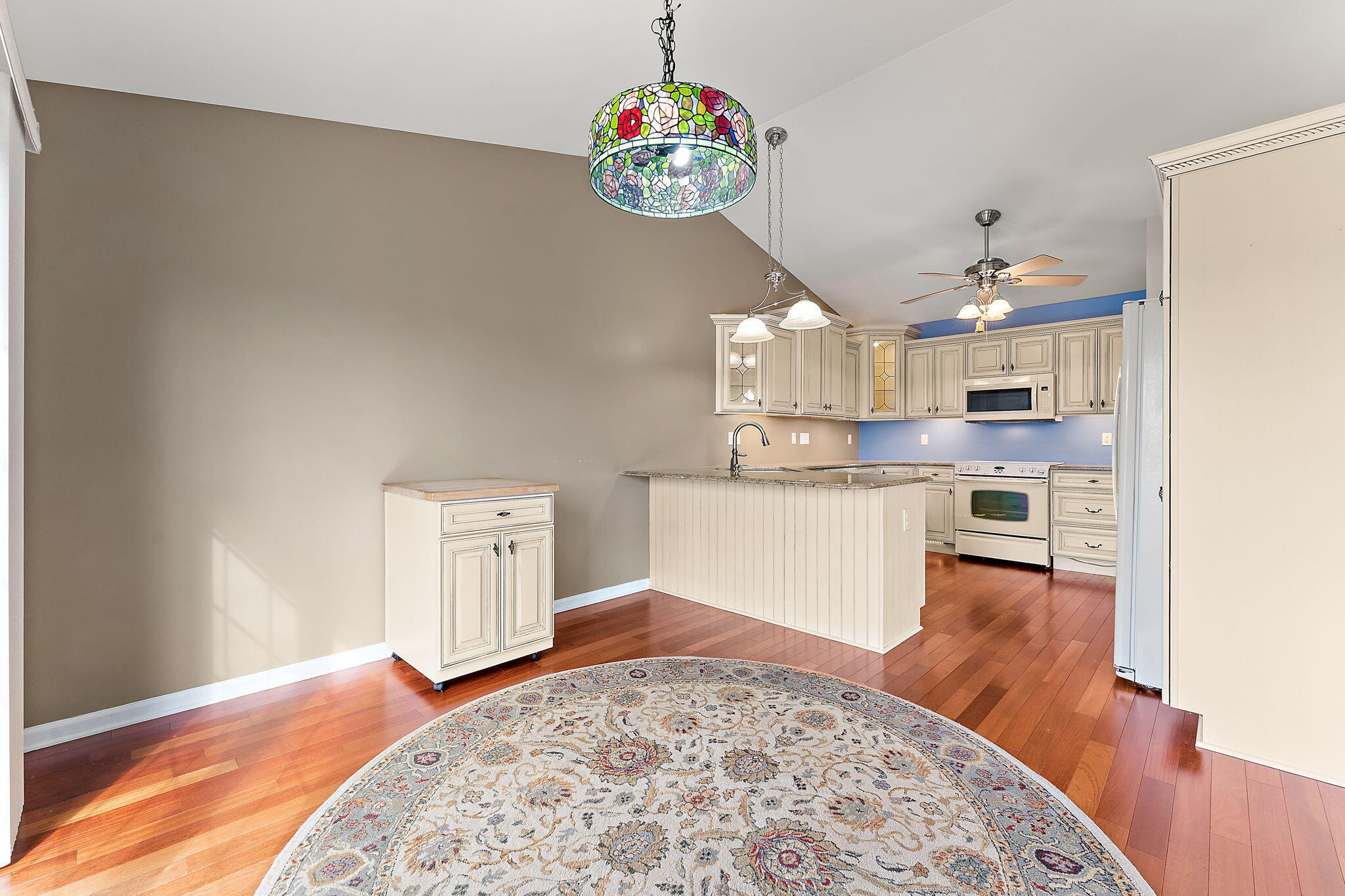 901 Veterans Lane Crown Point, IN 46307 - Photo 10 of 40 a living room with kitchen island granite countertop furniture and a chandelier
