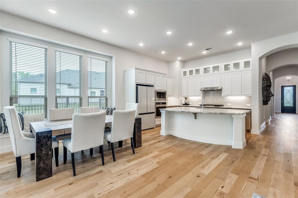 1835 Bell Court Van Alstyne, TX 75495 - Photo 8 of 39 Bright dining space seamlessly connected to kitchen and living areas for easy entertaining and daily living
