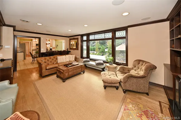 a living room with furniture and large windows