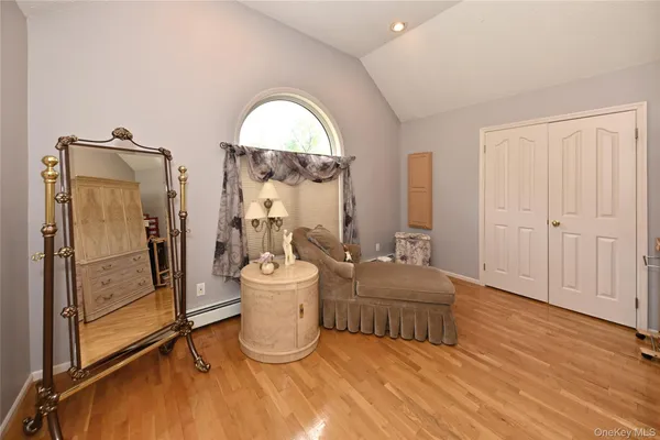 a bedroom with bed and window