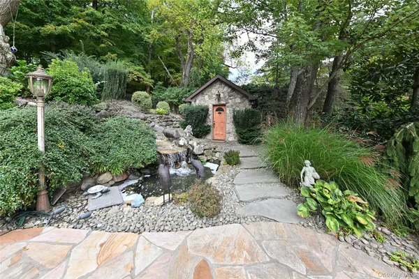 a view of a backyard with a large tree
