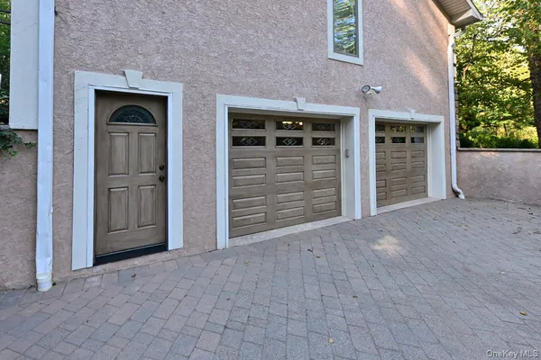 front view of a brick house with a large door